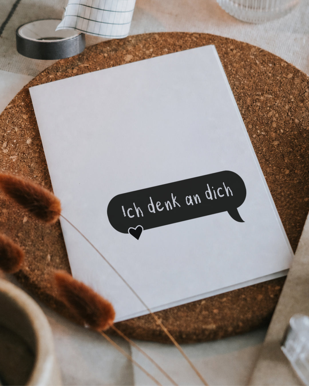 Klappkarte mit Spruch „Ich denk an dich.“ in einer Sprechblase mit kleinem Herz